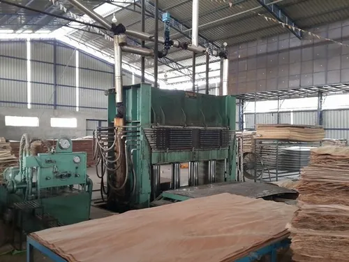 Early plywood hot press on the factory floor