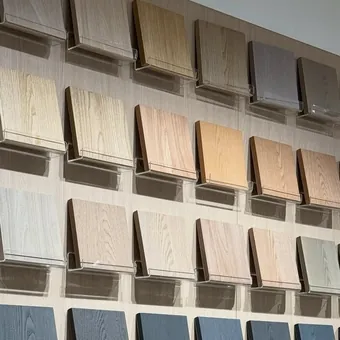 Wall display of veneer and laminate finishes